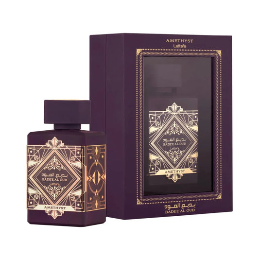 Purple perfume bottle and packaging with geometric designs on a white background