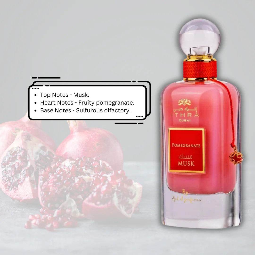 Perfume bottle with pomegranate and musk notes on a light gray background